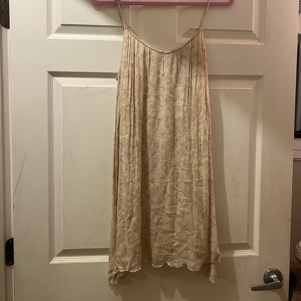NWOT. O’Neill sundress. Cream colored with floral design.